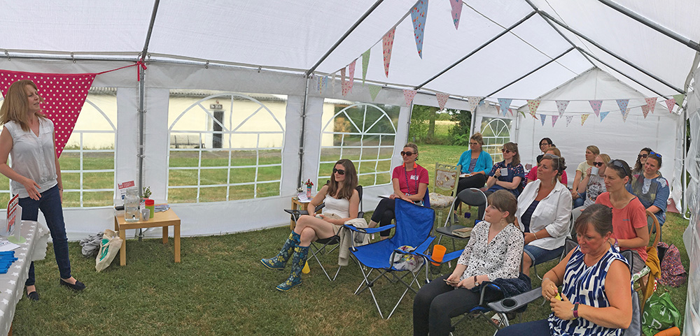 marquee full of enthusiastic business women